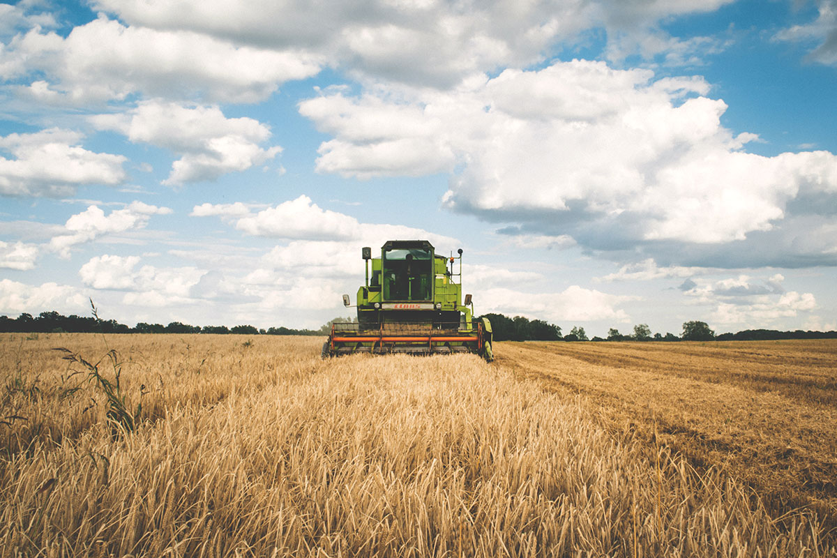 Stock image of a tractor in a farm field.