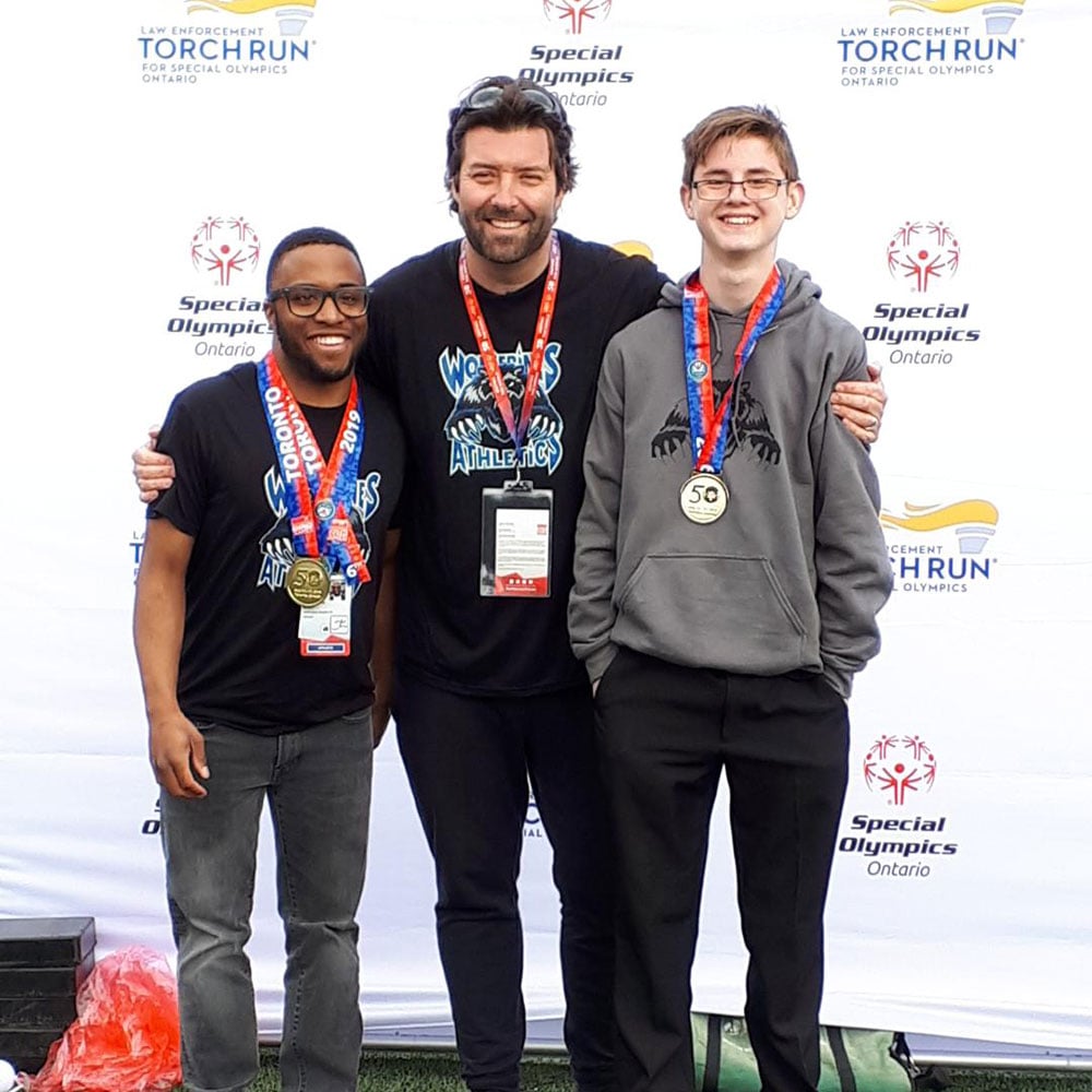 Wellington Heights SS students Thomas and Alec, pictured with Special Education Resource Teacher Ben McCabe, at the 2019 Youth Games (May 2019).