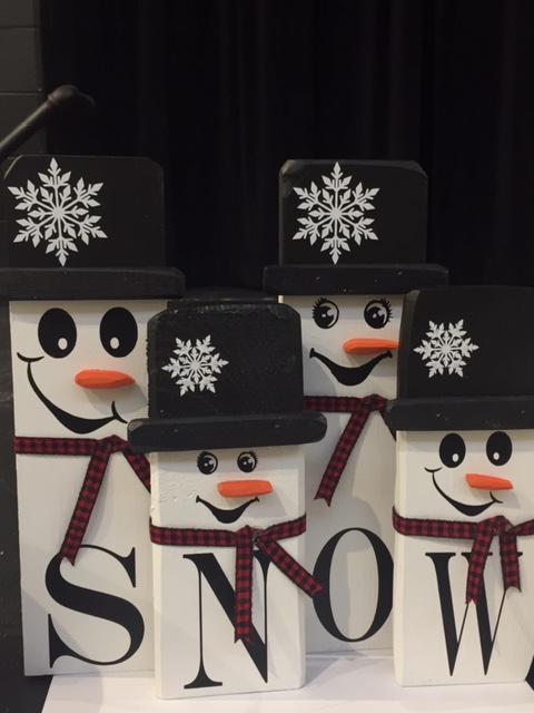 Photo of four snow people
