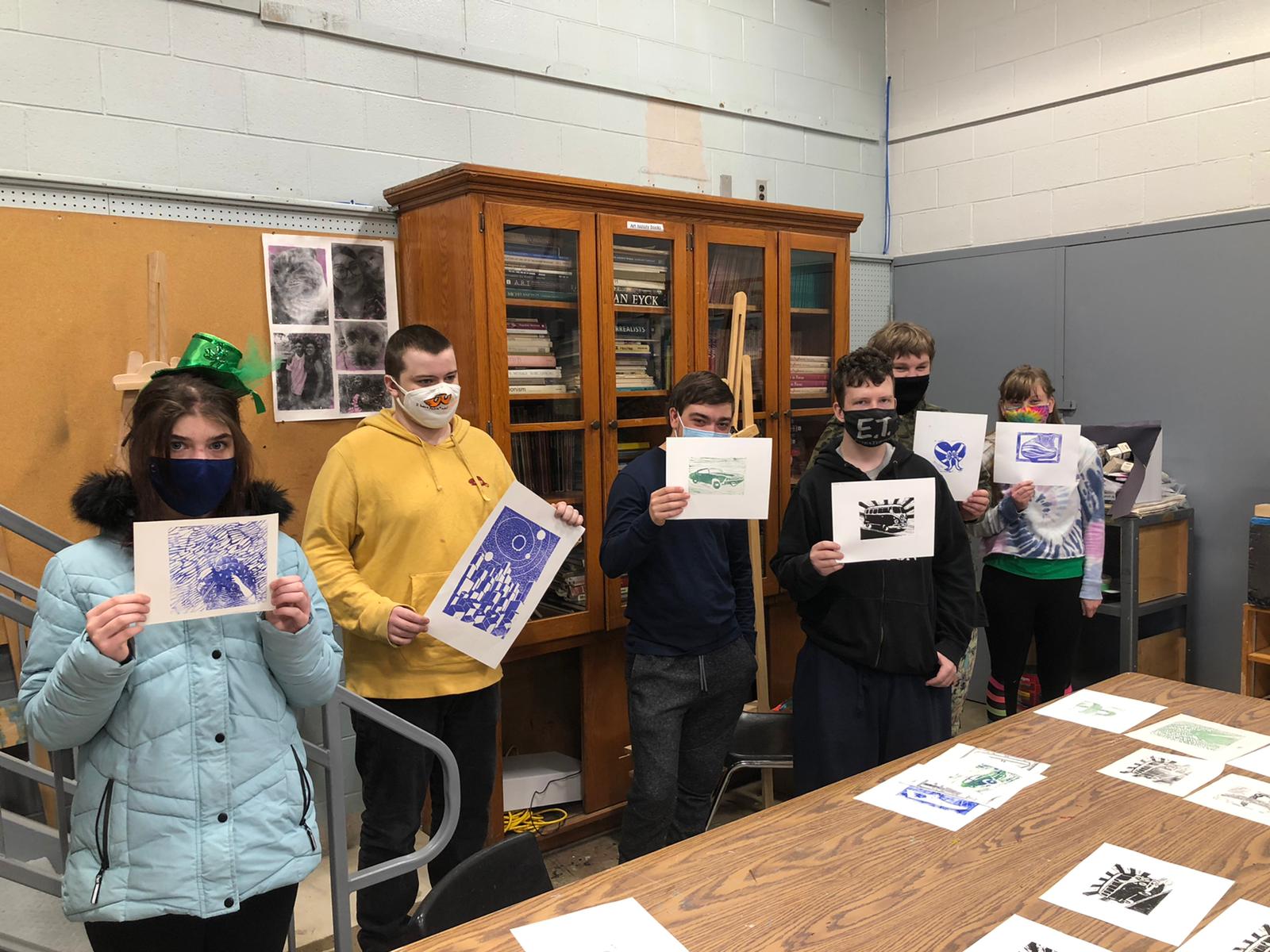 Norwell students with linocut art pieces