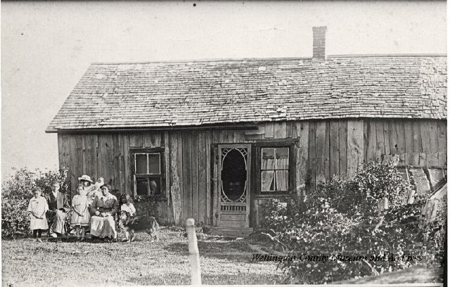 This photo features the Hisson sitting outside their family home.