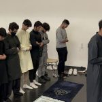 This photo features students praying on prayer mats.