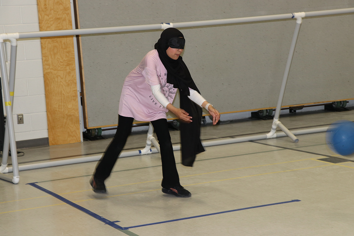 Students playing goalball