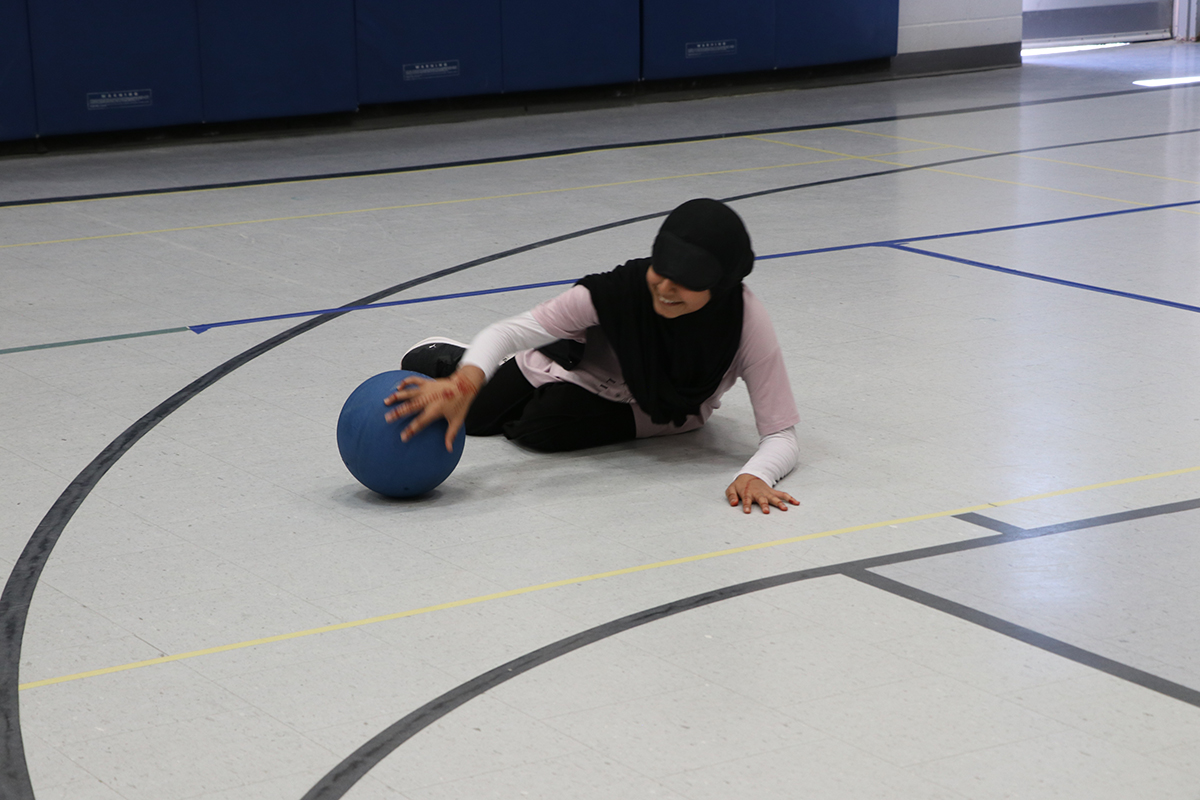 Students playing goalball