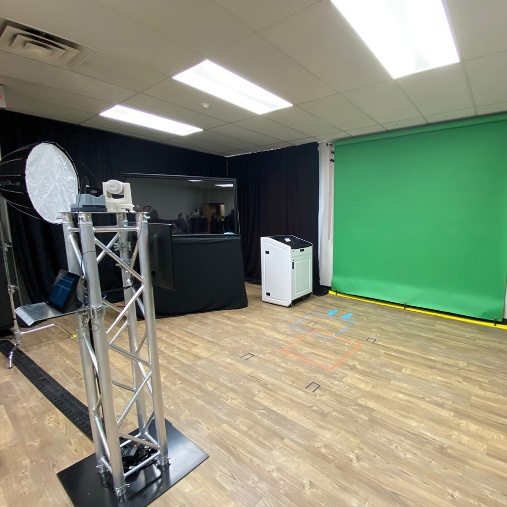 A photo of the interior of the UGDSB's Innovation Lab, showing a green screen and camera rig.