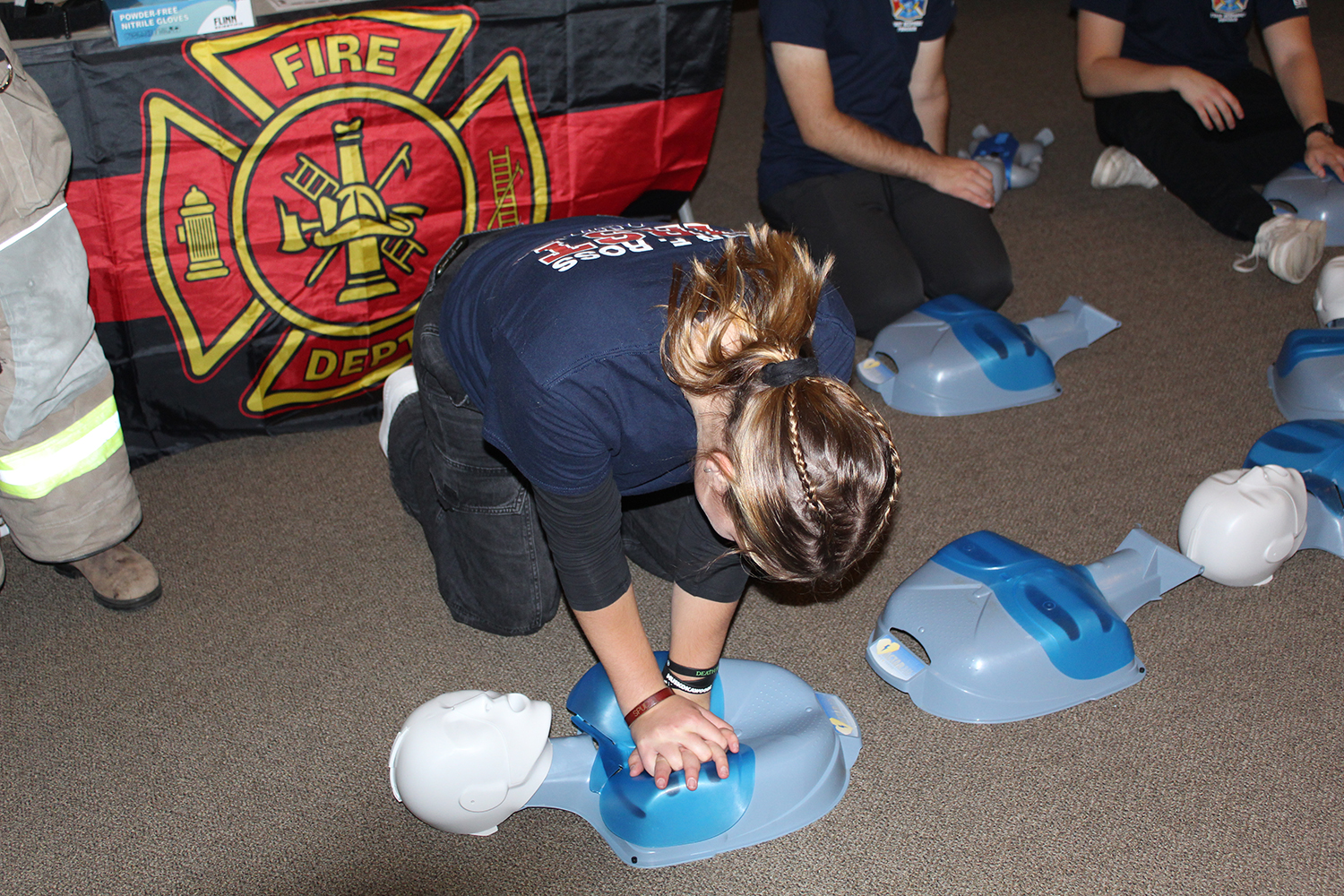 A student performing cpr in the fire program