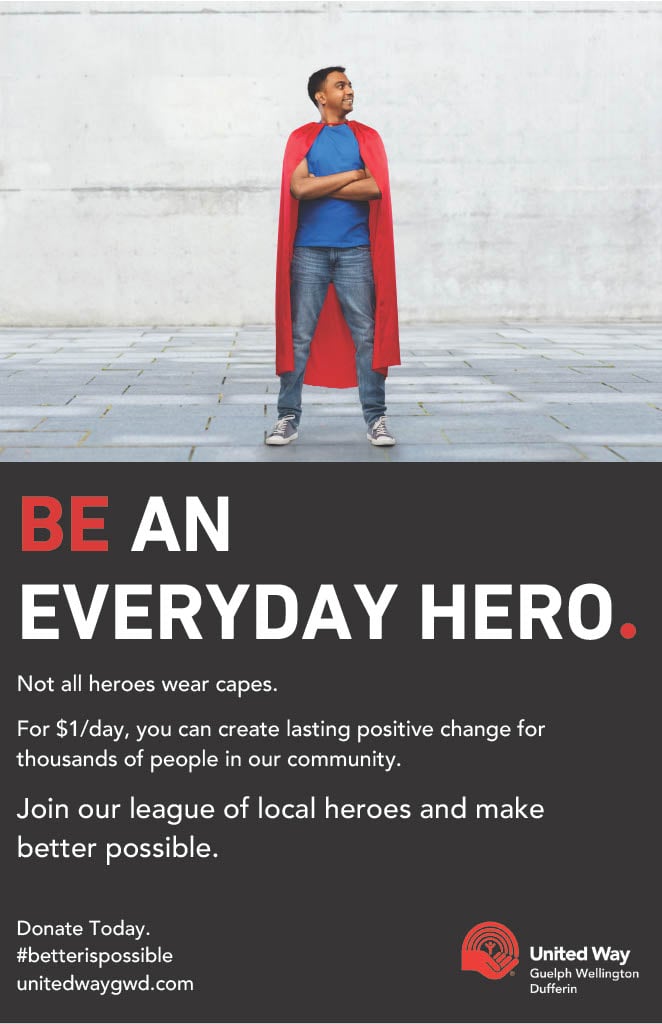 This photo features a promo ad from United Way with a man wearing a cape and with the words "Be an everyday hero".