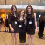 This photo features three female students dressed semi-formally in black.